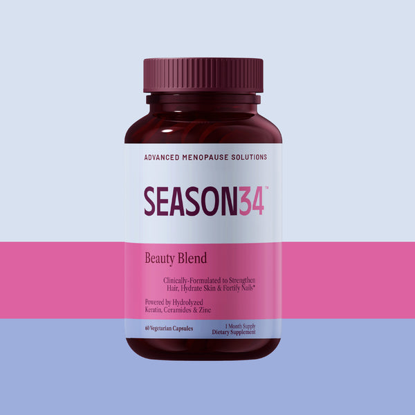 Supplement bottle labeled 'Season34 Beauty Blend clinically-formulated to strengthen hair, Hydrate skin and Fortify Nails' on a two-tone pink and purple background
