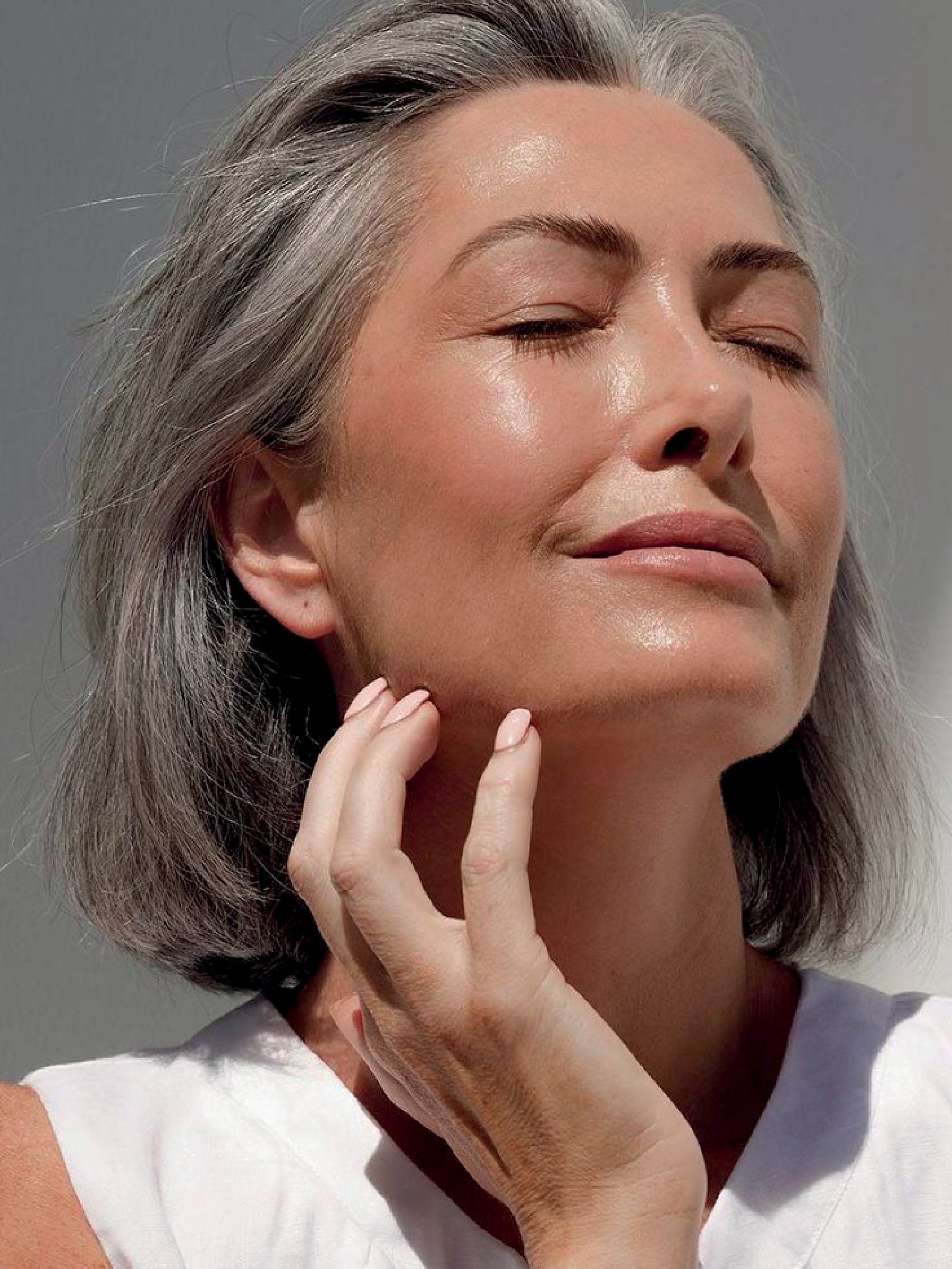 A peaceful older woman during perimenopause.